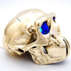 Image for article titled Metal Skull Table Lamp Is Beyond Creepy